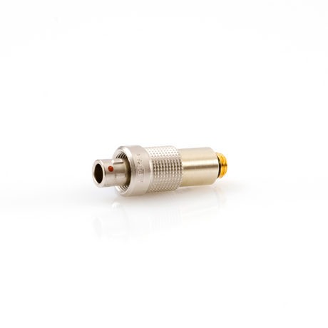 A silver-colored DPA microlock to 3-pin LEMO adapter for microphones.